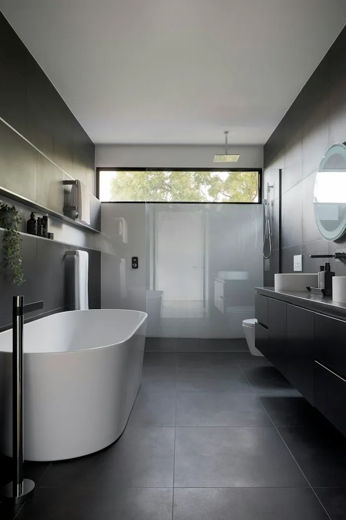 Freestanding reglazed bathtub and walk-in shower in a Turtle Rock, Irvine bathroom